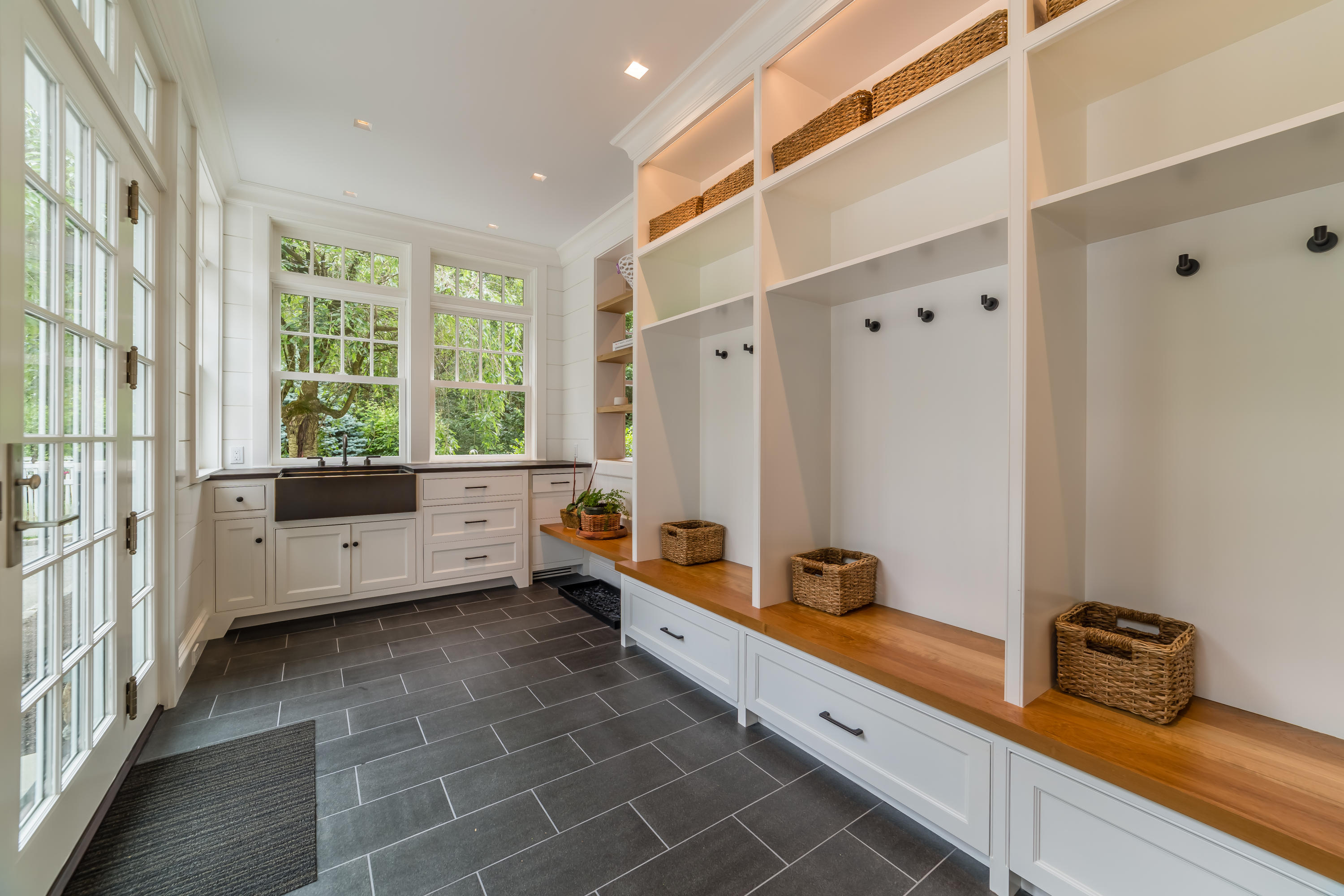 85 Lukes Wood Road New Canaan, CT 06840 - Photo 16 of 40 a large bathroom with a tub a double vanity sink a mirror and a shower