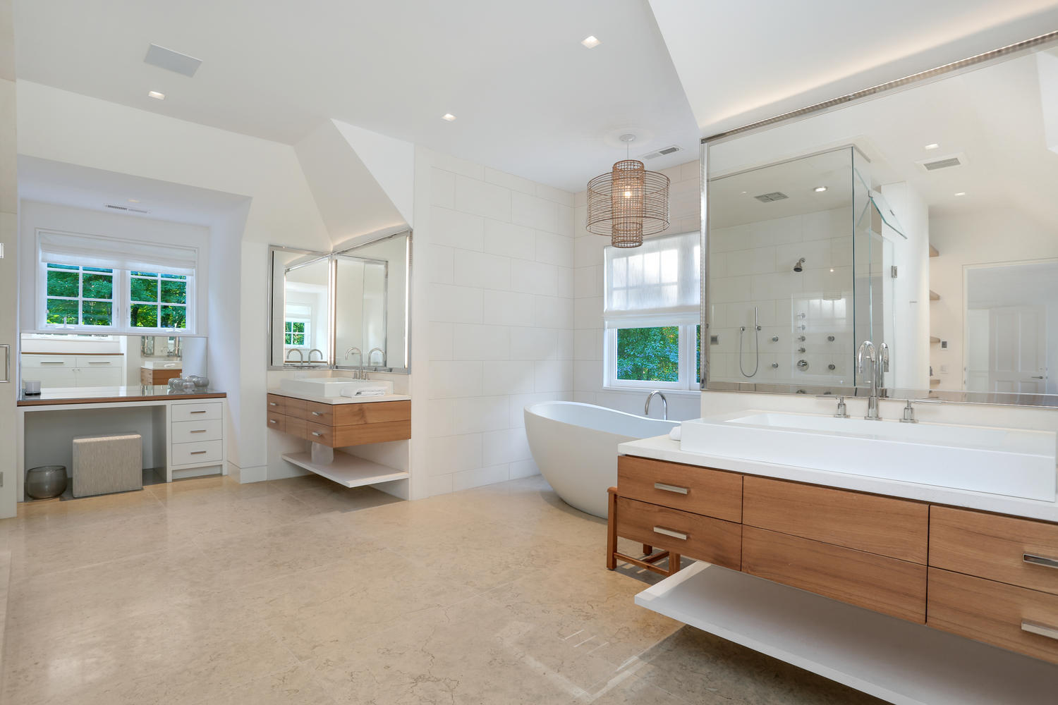 85 Lukes Wood Road New Canaan, CT 06840 - Photo 20 of 40 a bathroom with a tub a sink and mirror