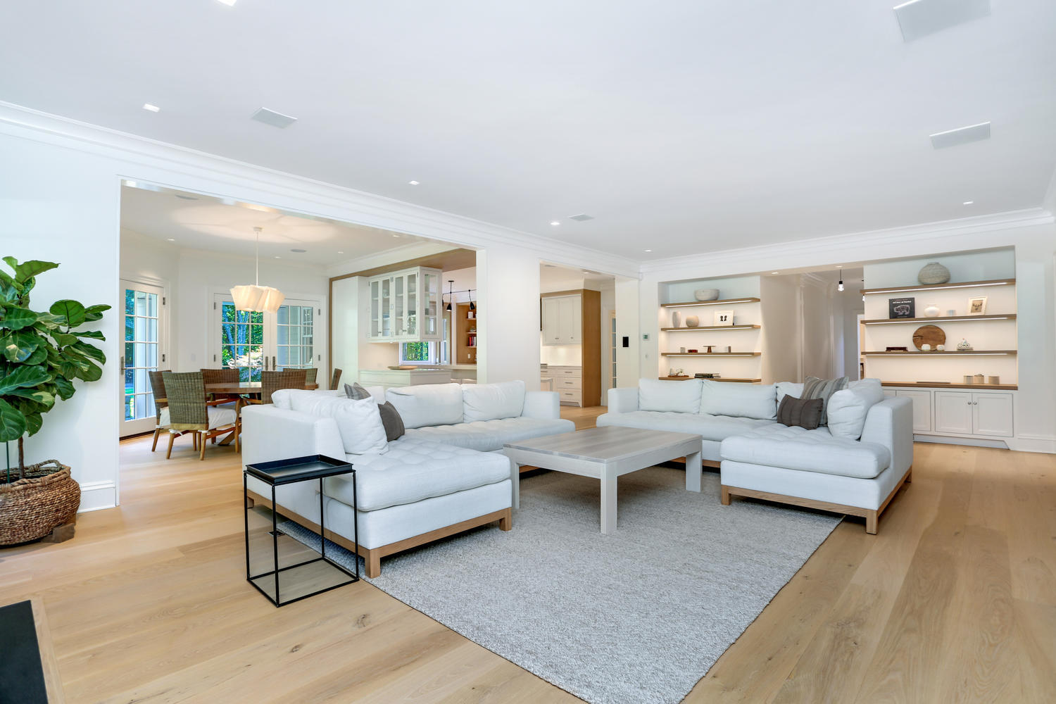 85 Lukes Wood Road New Canaan, CT 06840 - Photo 3 of 40 a living room with furniture and view of kitchen