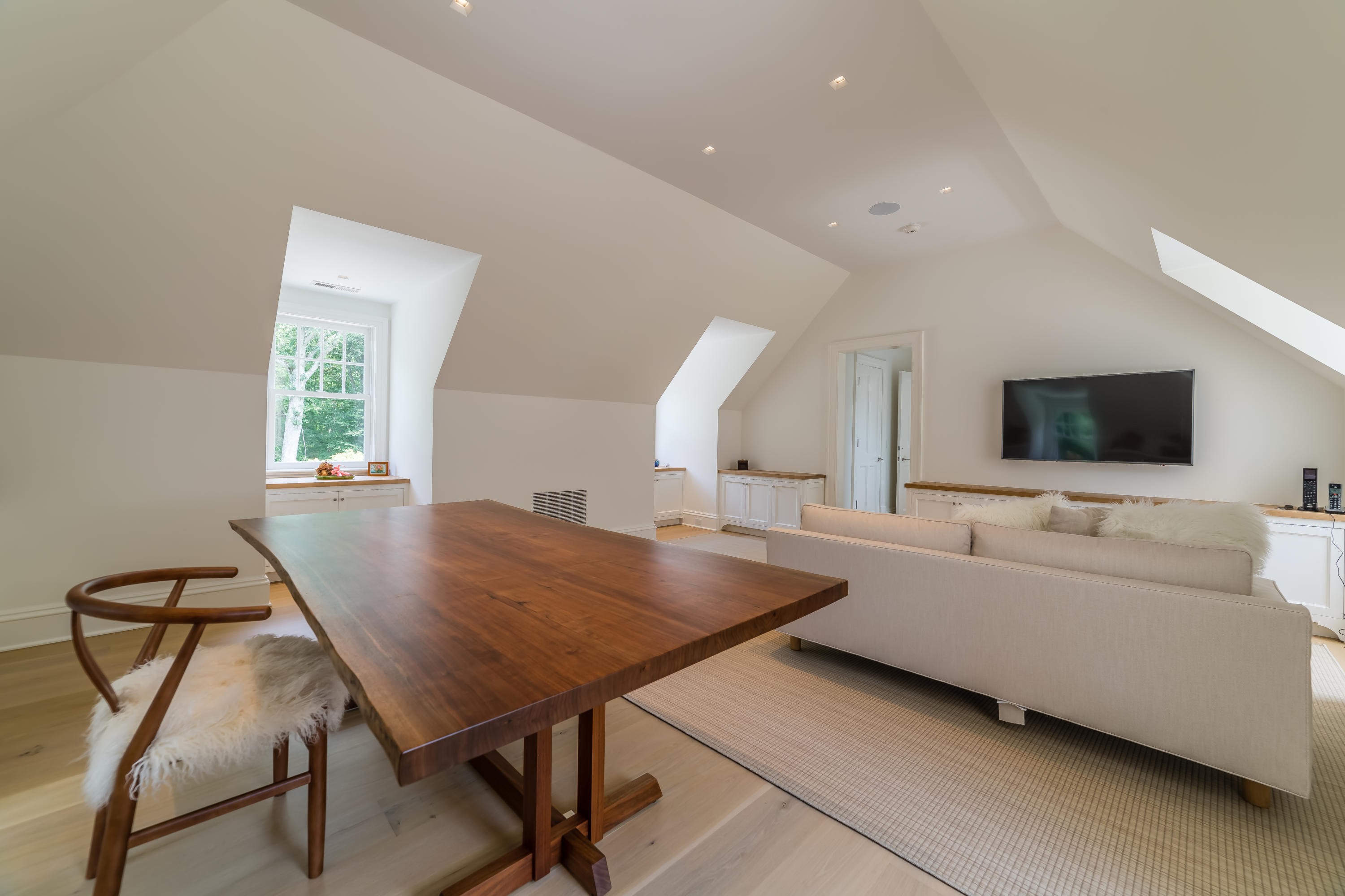 85 Lukes Wood Road New Canaan, CT 06840 - Photo 24 of 40 a living room with furniture and a flat screen tv