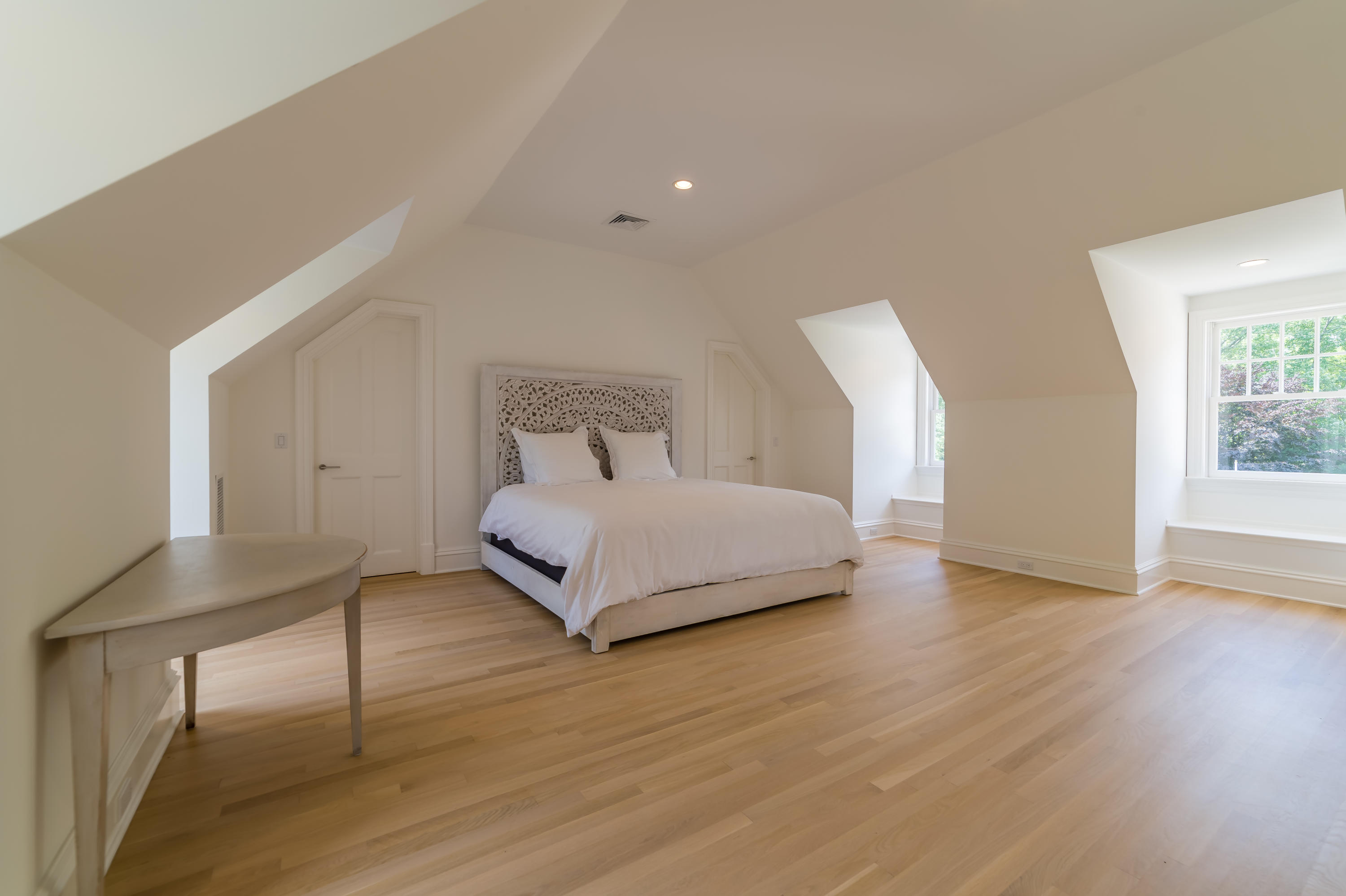 85 Lukes Wood Road New Canaan, CT 06840 - Photo 26 of 40 a bedroom with a bed and a table