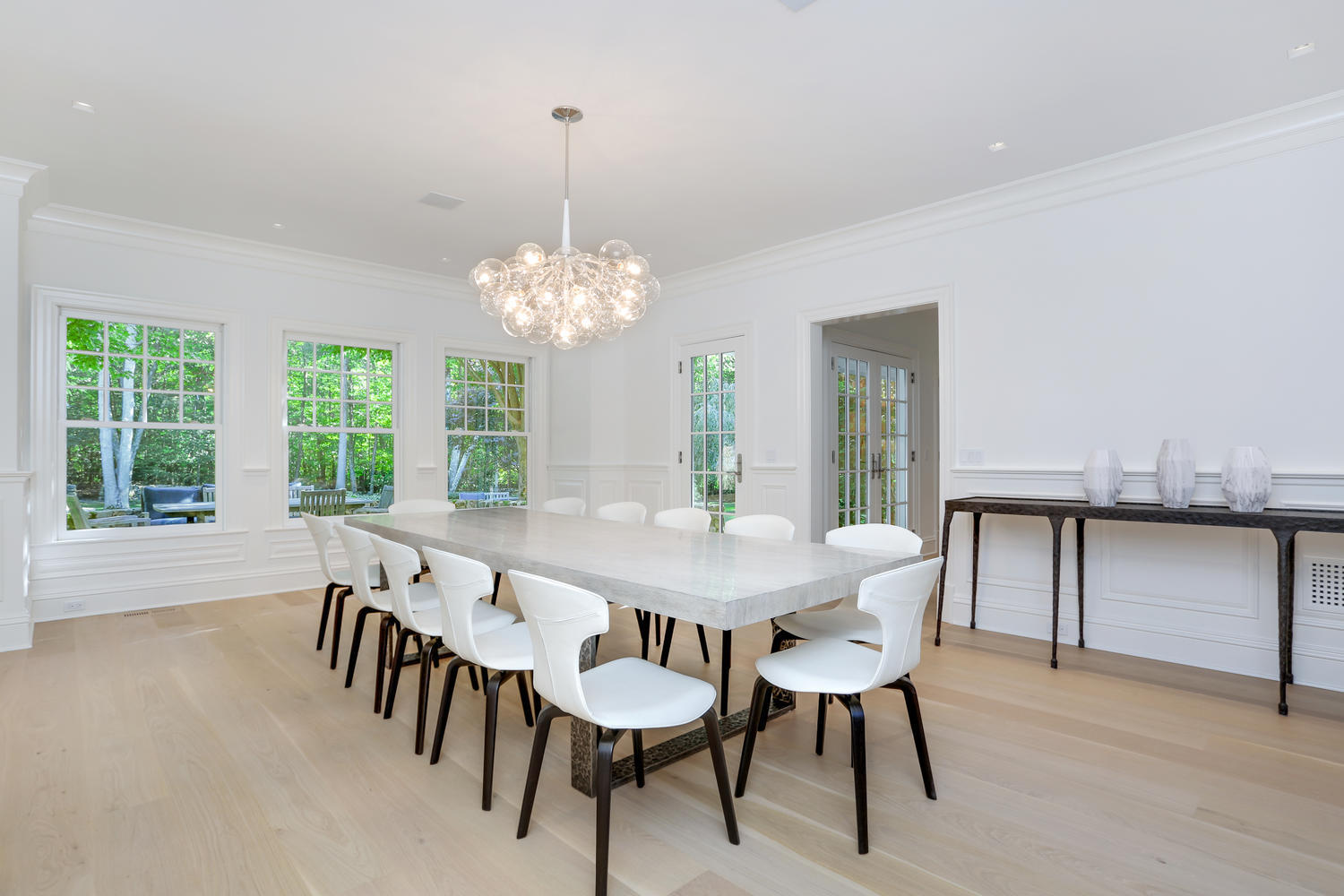 85 Lukes Wood Road New Canaan, CT 06840 - Photo 4 of 40 a view of a dining room with furniture window and outside view