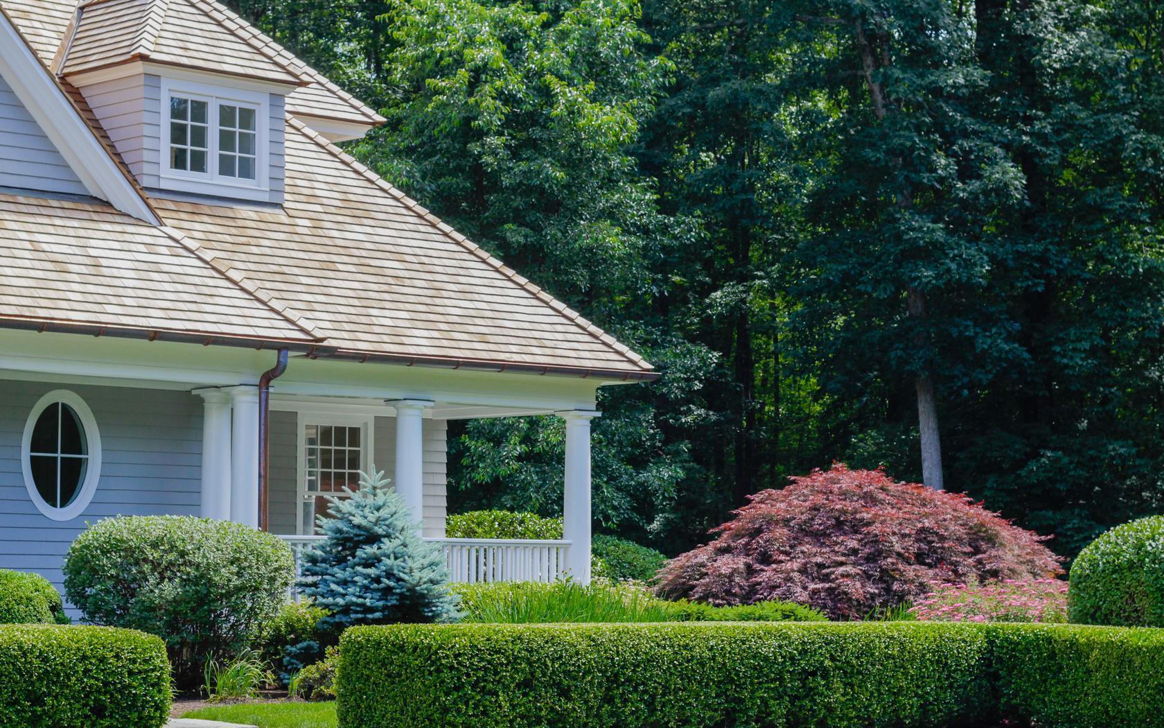 85 Lukes Wood Road New Canaan, CT 06840 - Photo 38 of 40 a view of a house with a yard