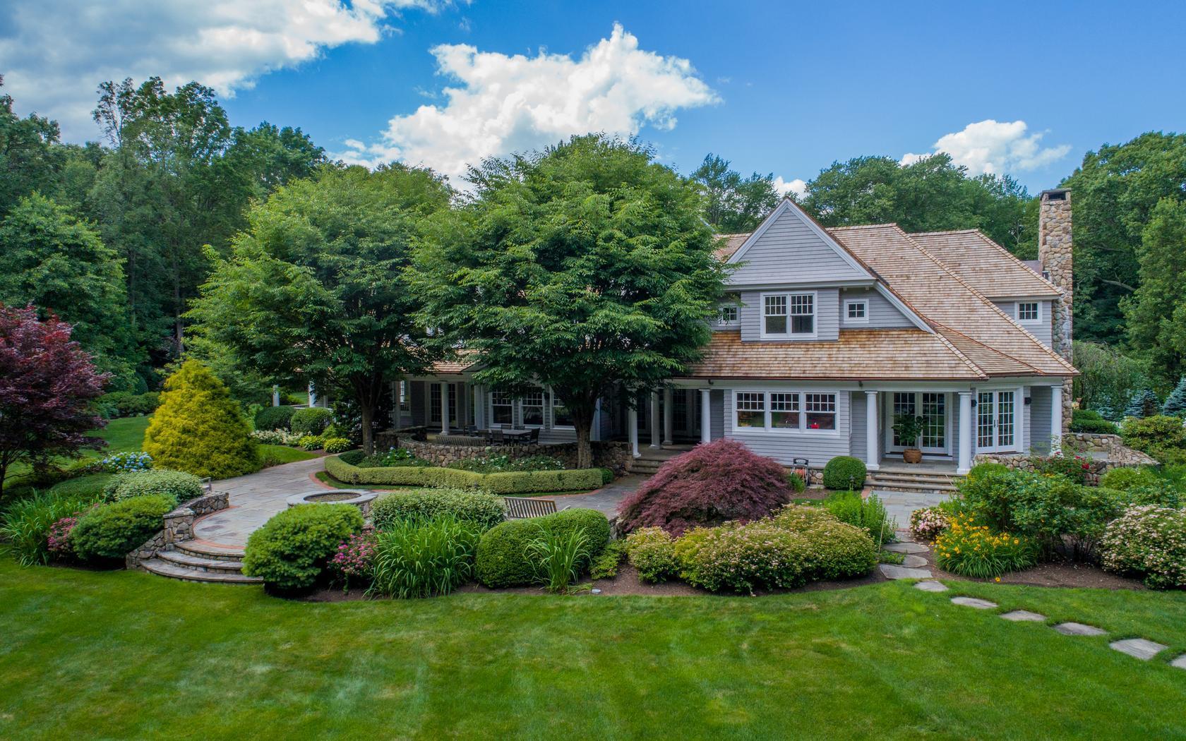 85 Lukes Wood Road New Canaan, CT 06840 - Photo 39 of 40 a front view of house with yard and green space