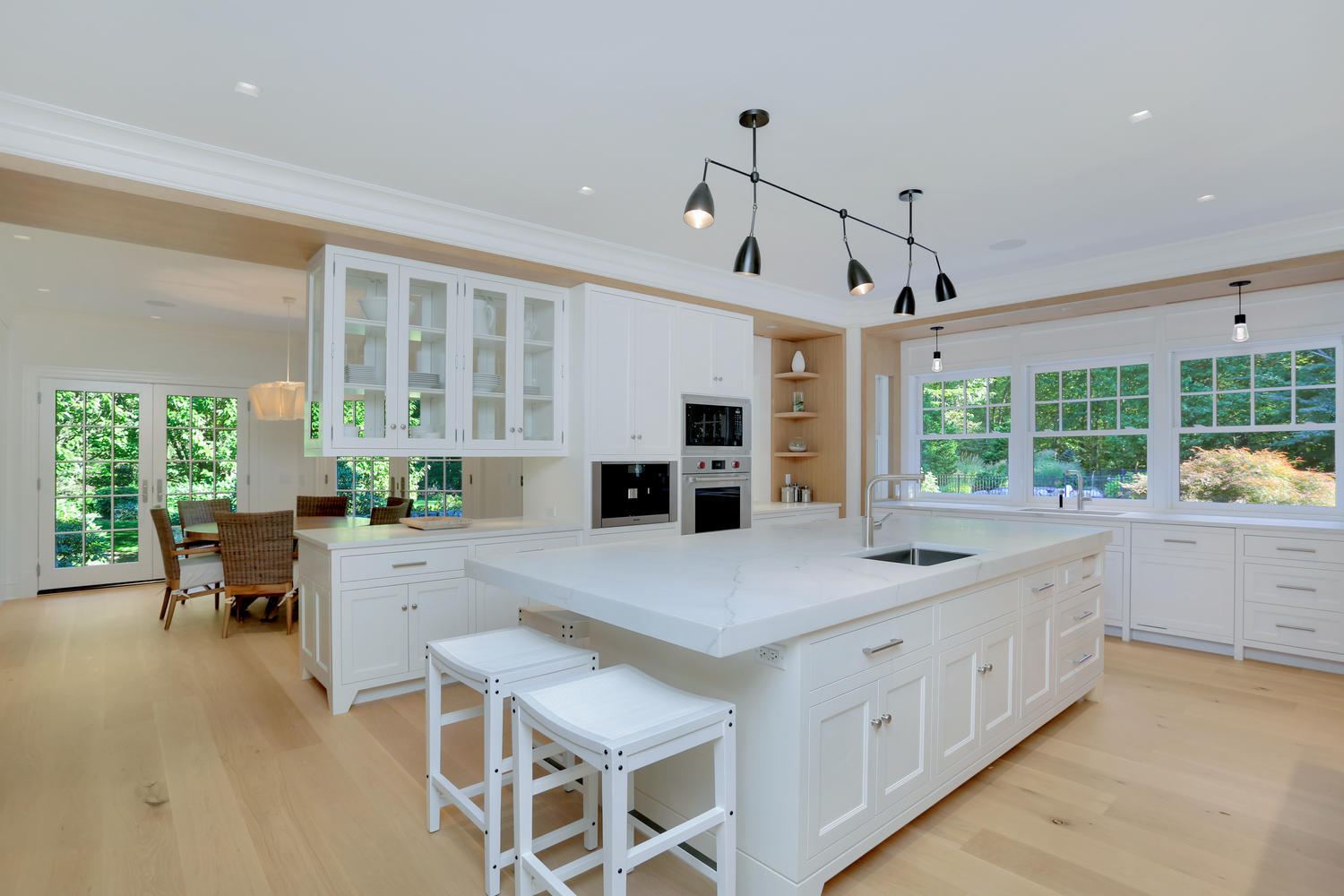 85 Lukes Wood Road New Canaan, CT 06840 - Photo 6 of 40 a kitchen with stainless steel appliances granite countertop a stove and a refrigerator