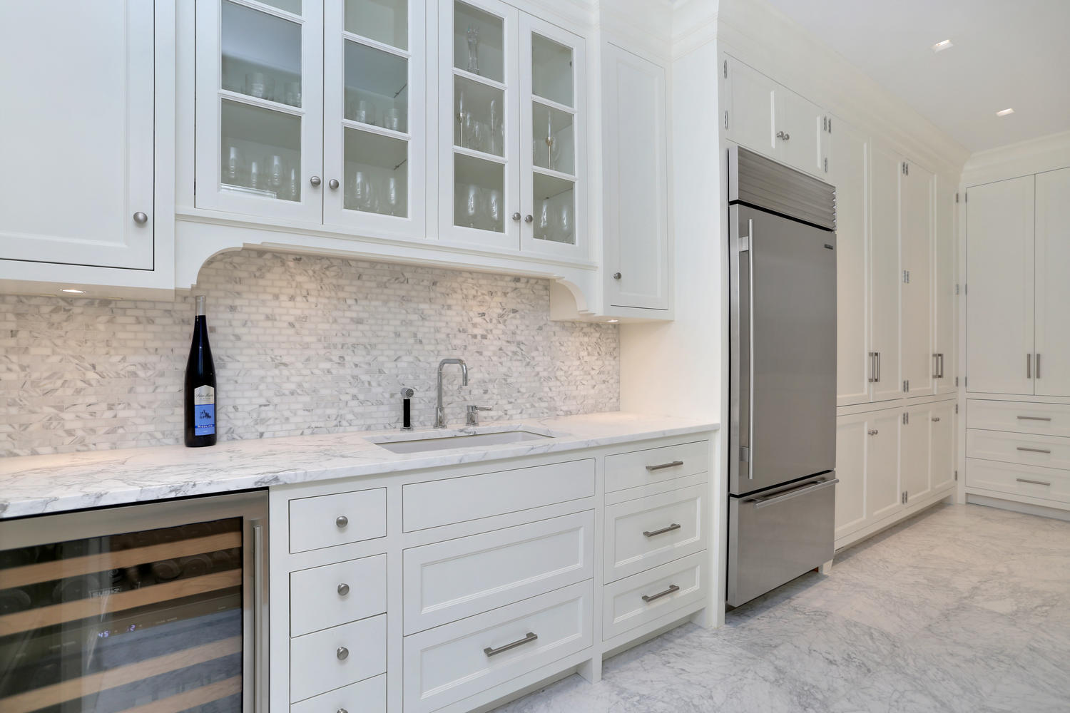 85 Lukes Wood Road New Canaan, CT 06840 - Photo 7 of 40 a kitchen with stainless steel appliances white cabinets and a sink