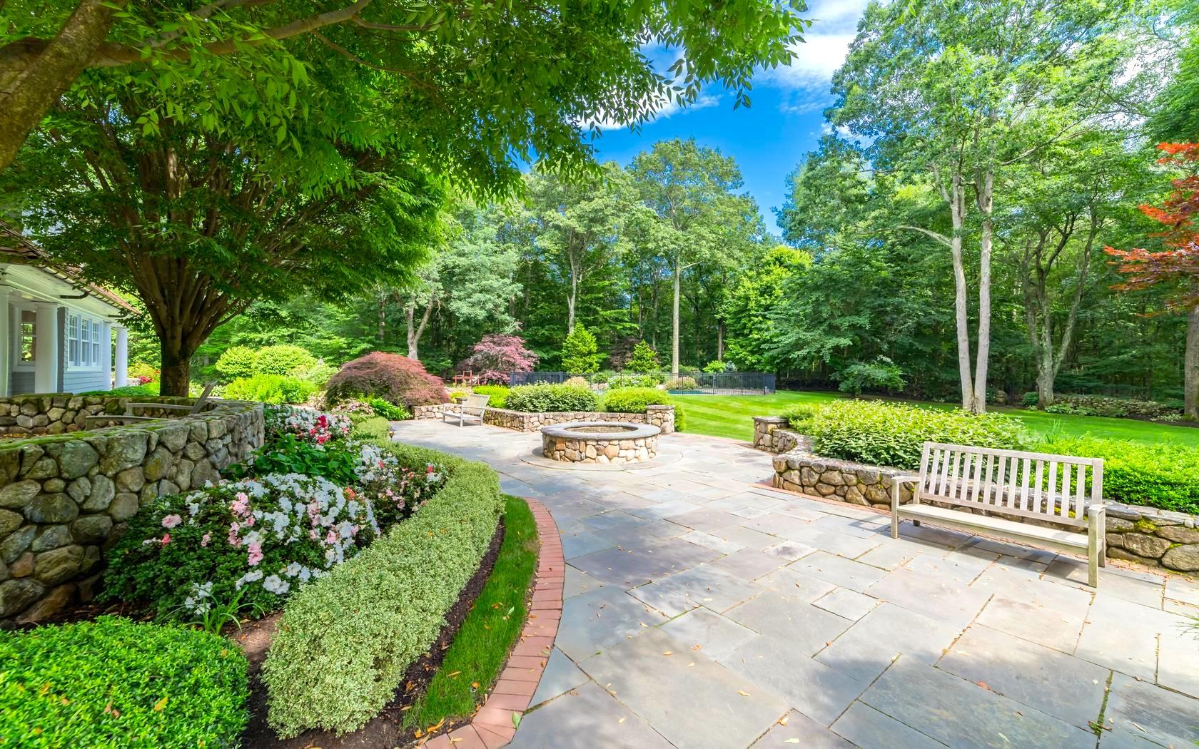 85 Lukes Wood Road New Canaan, CT 06840 - Photo 9 of 40 a view of a garden with a fountain