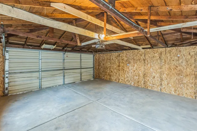 a view of a room with wooden walls