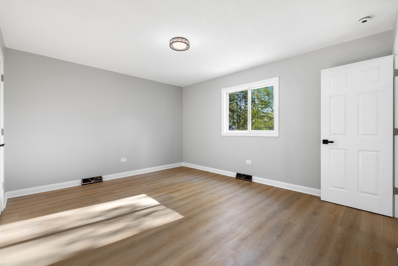 22 North 12th Street St. Charles, IL 60174 - Photo 14 of 37 an empty room with wooden floor and windows