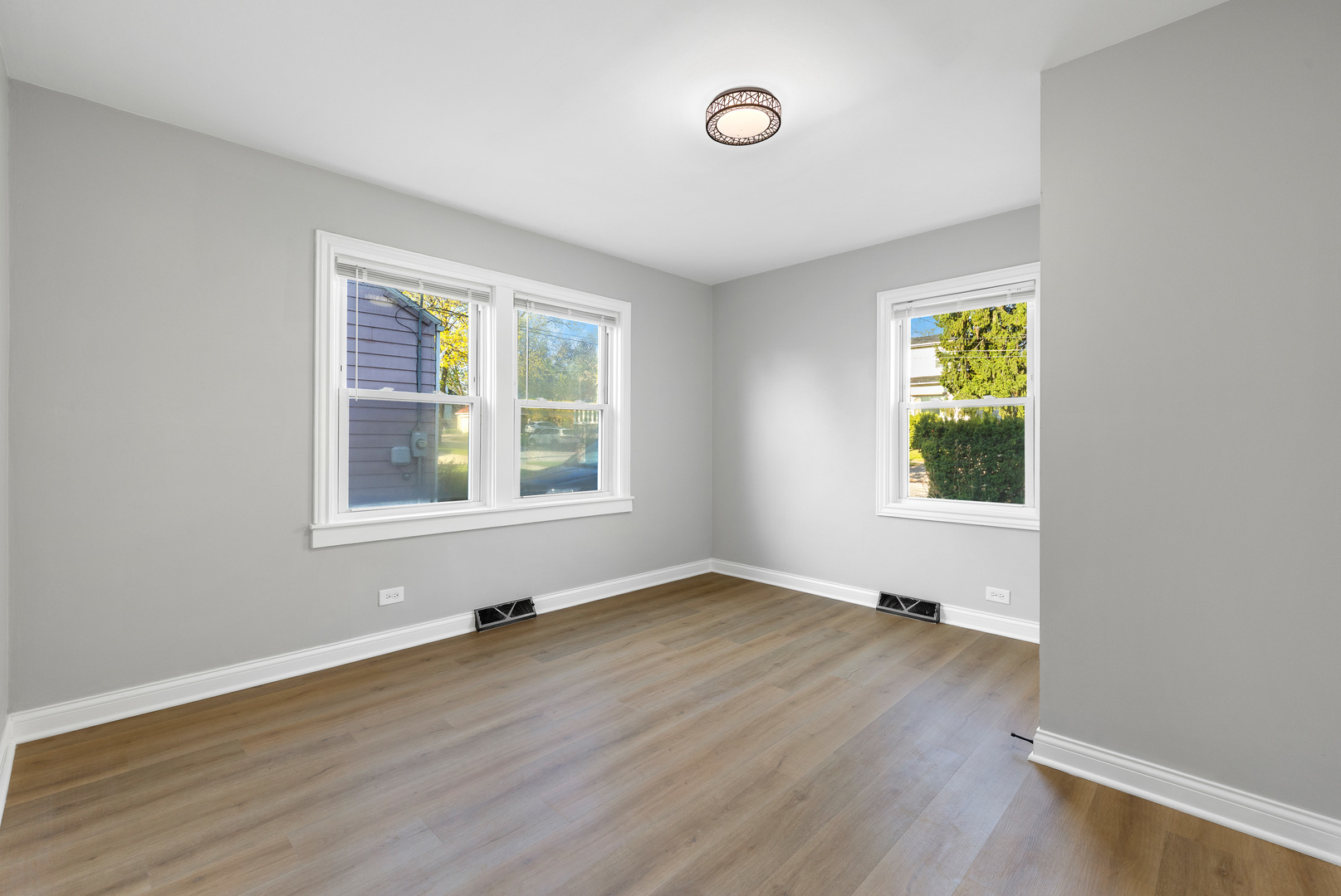 22 North 12th Street St. Charles, IL 60174 - Photo 18 of 37 an empty room with wooden floor and windows