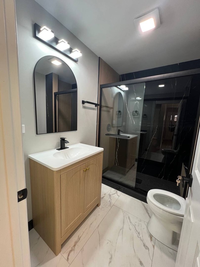 22 North 12th Street St. Charles, IL 60174 - Photo 20 of 37 a bathroom with a double vanity sink and a mirror