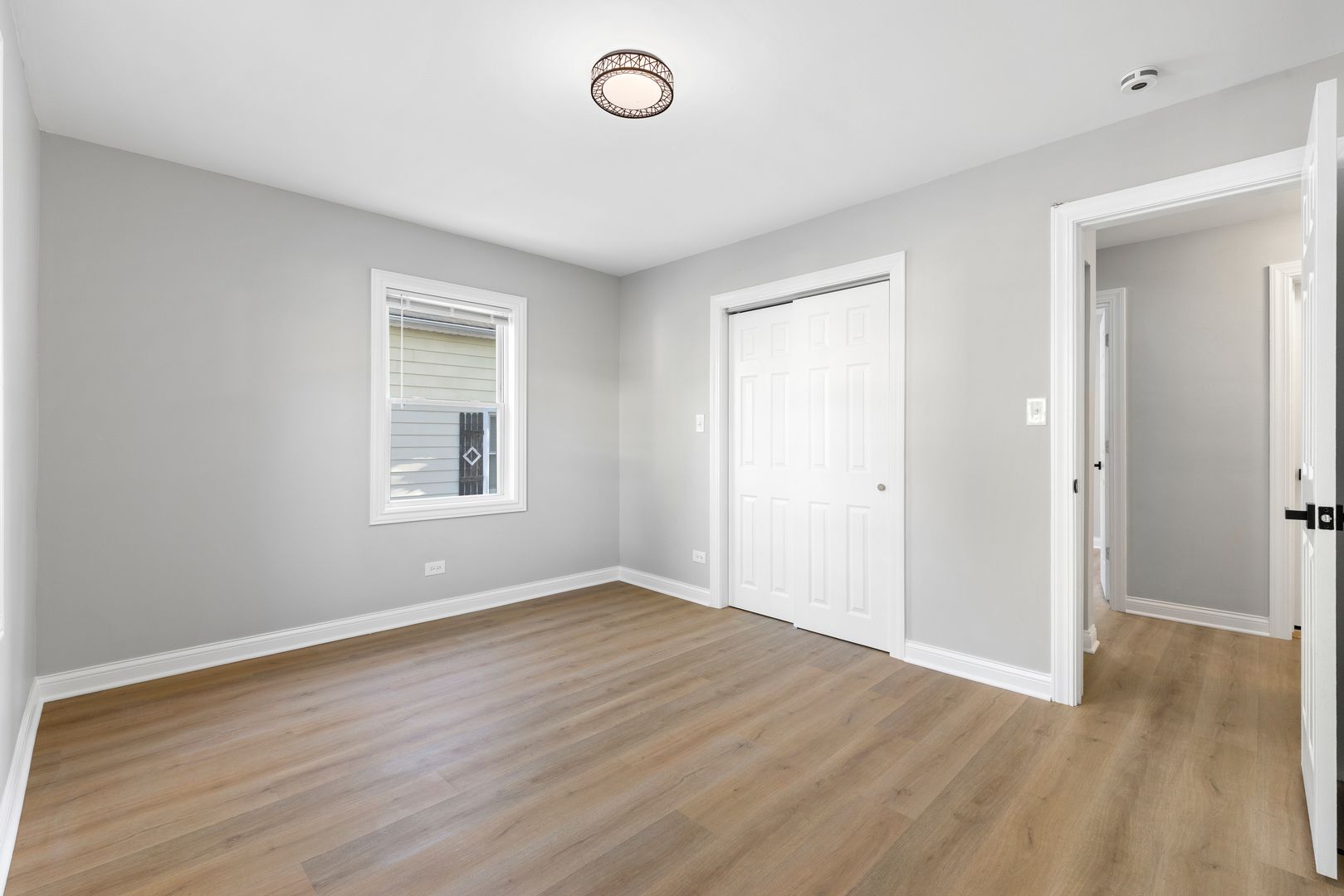 22 North 12th Street St. Charles, IL 60174 - Photo 22 of 37 an empty room with wooden floor and windows