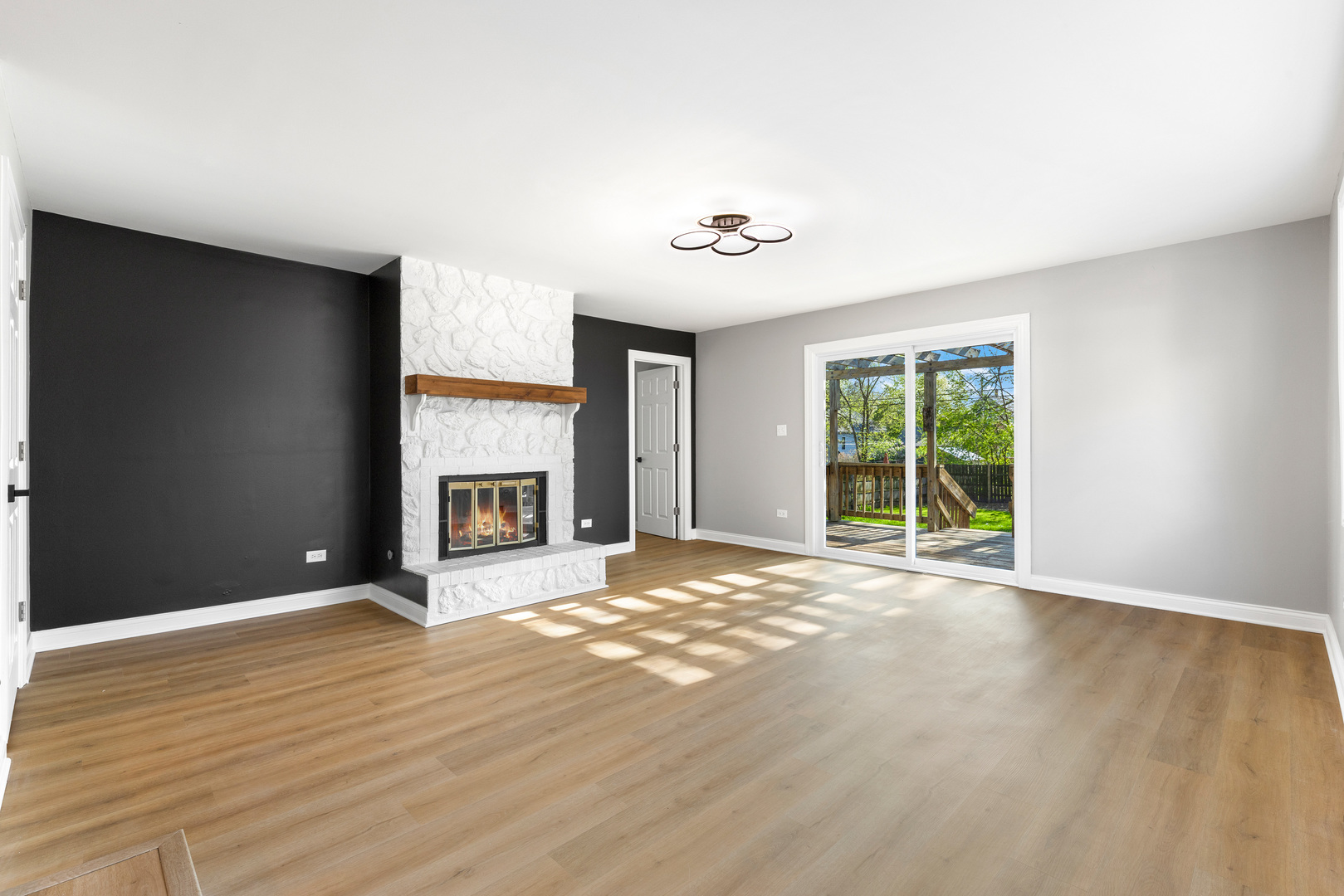 22 North 12th Street St. Charles, IL 60174 - Photo 6 of 37 a view of an empty room with a window and fireplace