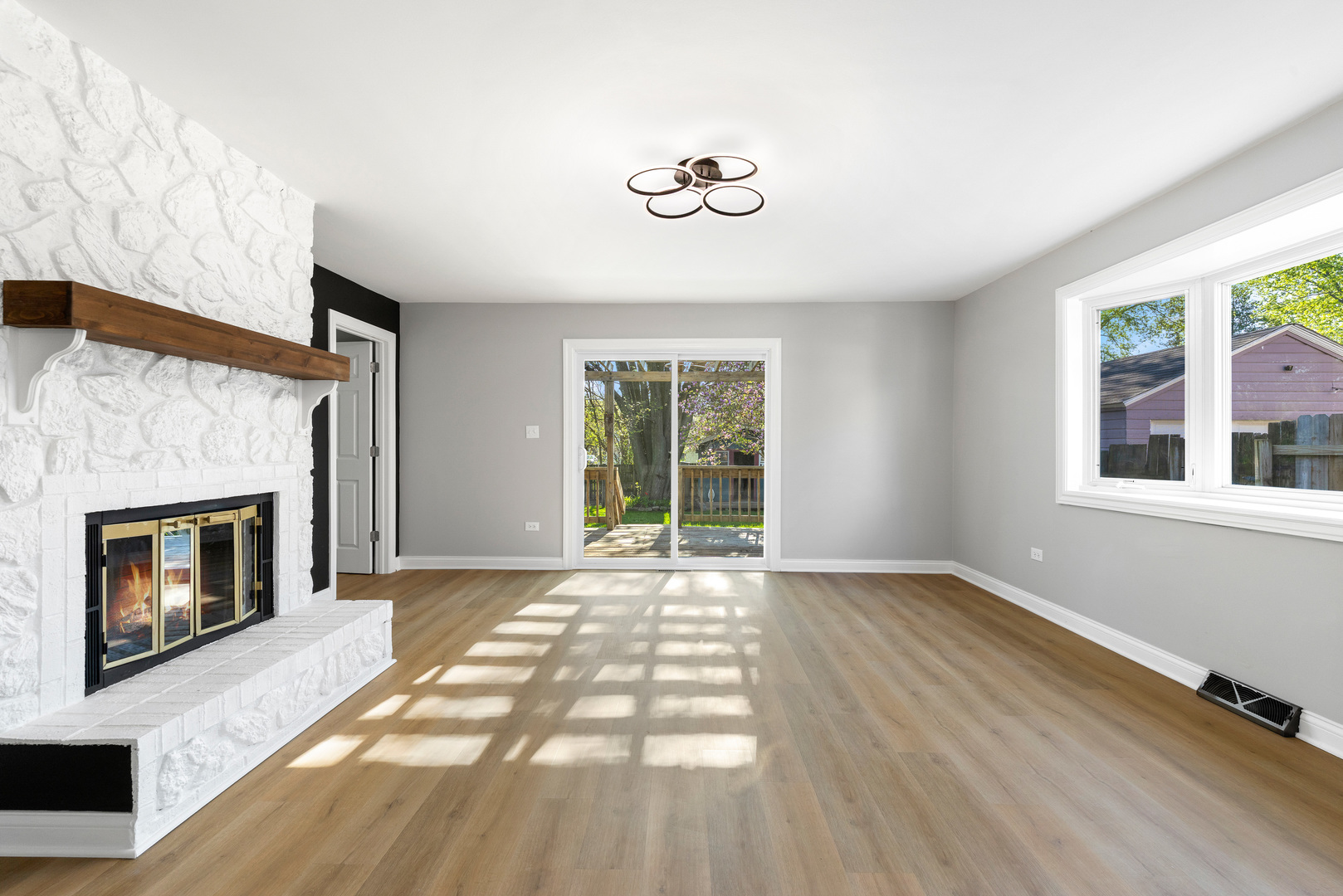 22 North 12th Street St. Charles, IL 60174 - Photo 7 of 37 a view of an empty room with a fireplace and a window