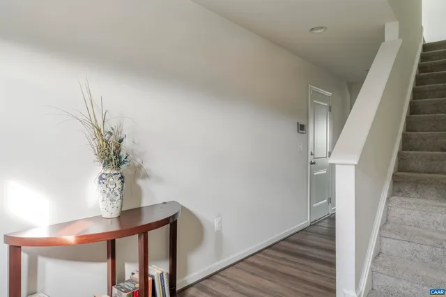 a view of entryway with wooden floor