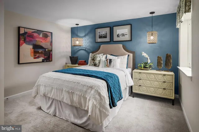 a bedroom with a bed and a cabinet