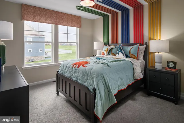 a bedroom with a bed and a night stand