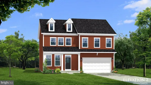 front view of a brick house with a yard