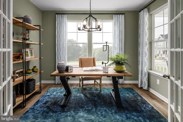 a workspace with furniture and a window