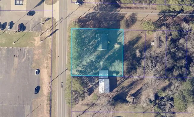 a view of a house with a tree