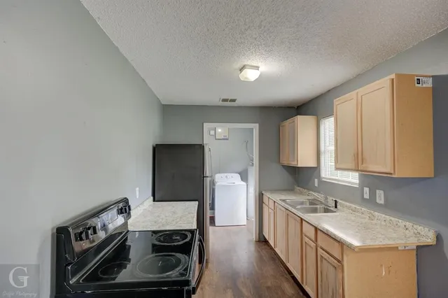a kitchen with a stove and a microwave