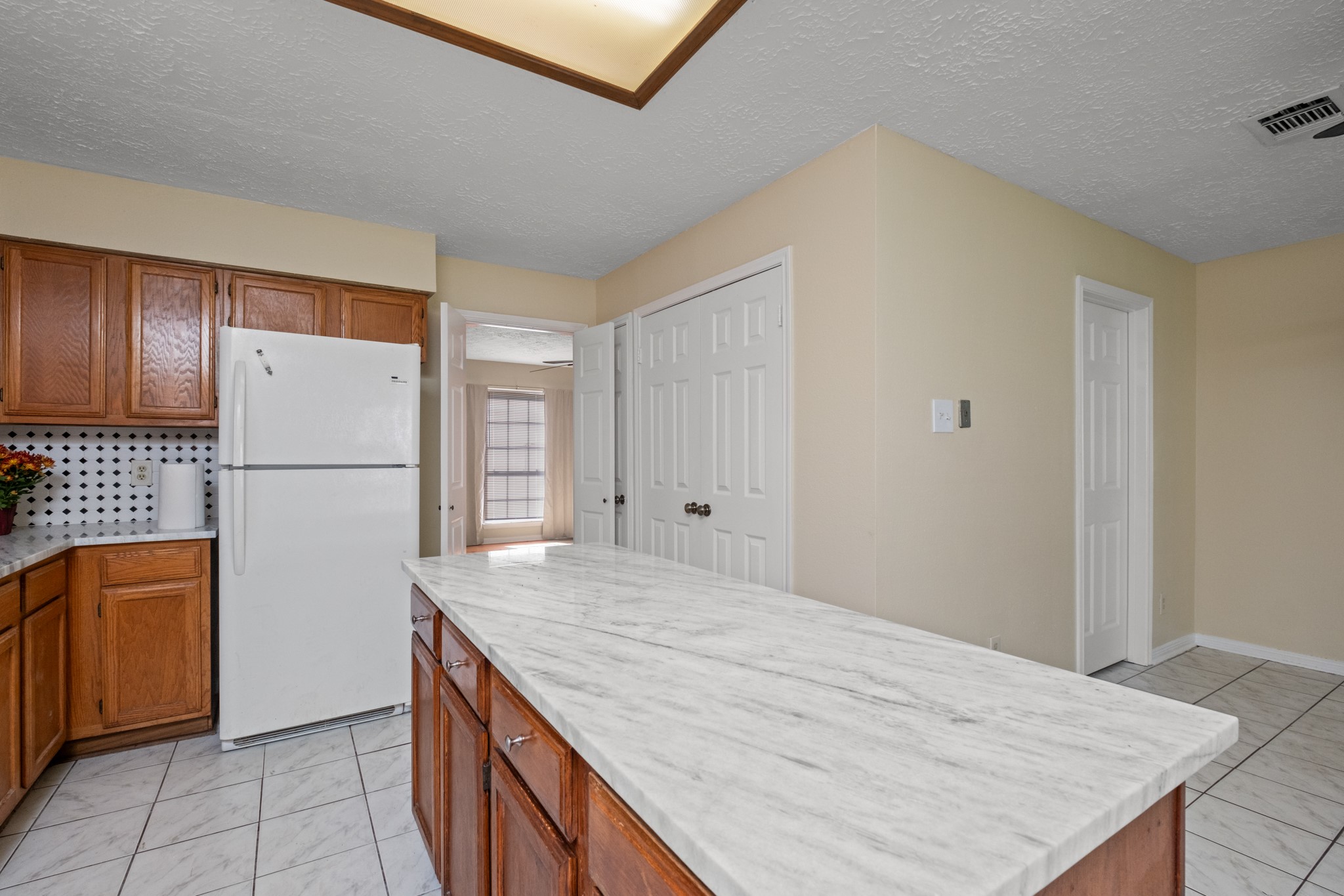 4131 Club Valley Drive Houston, TX 77082 - Photo 15 of 28 a kitchen with stainless steel appliances granite countertop a refrigerator sink and cabinets
