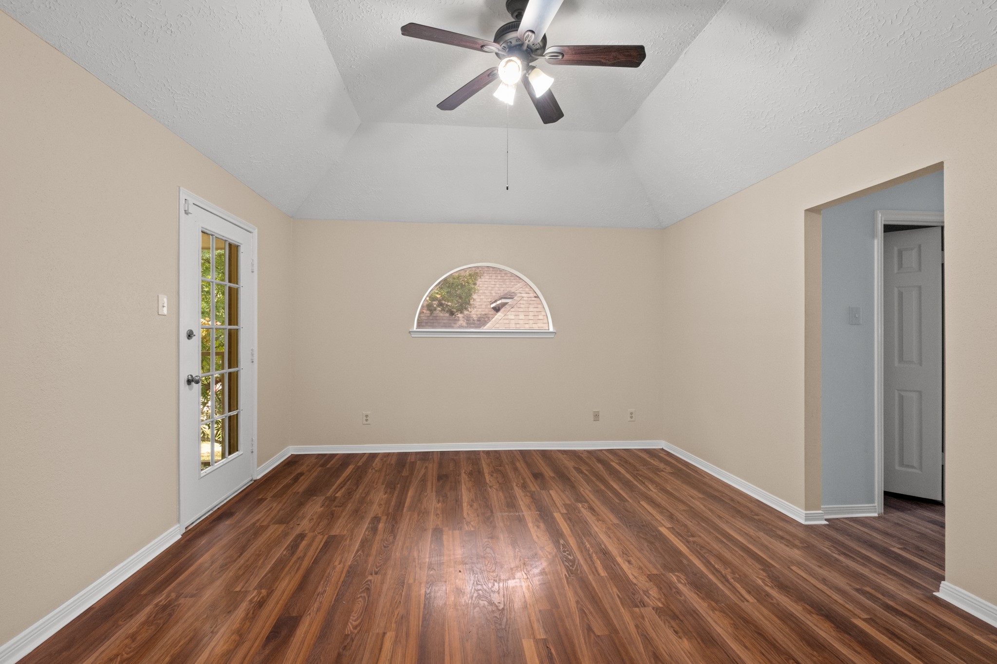 4131 Club Valley Drive Houston, TX 77082 - Photo 20 of 28 an empty room with a hardwood and ceiling fan