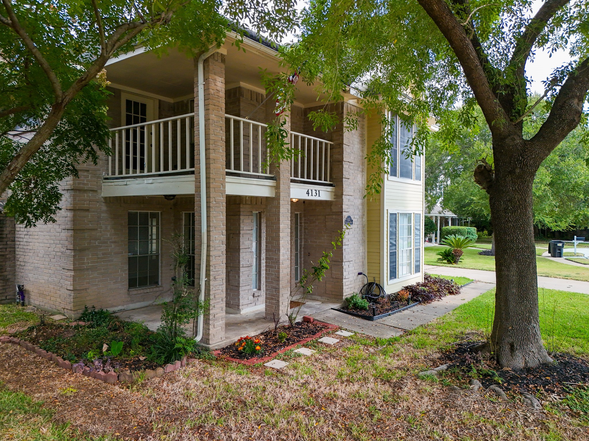 4131 Club Valley Drive Houston, TX 77082 - Photo 2 of 28 a front view of a house with a yard