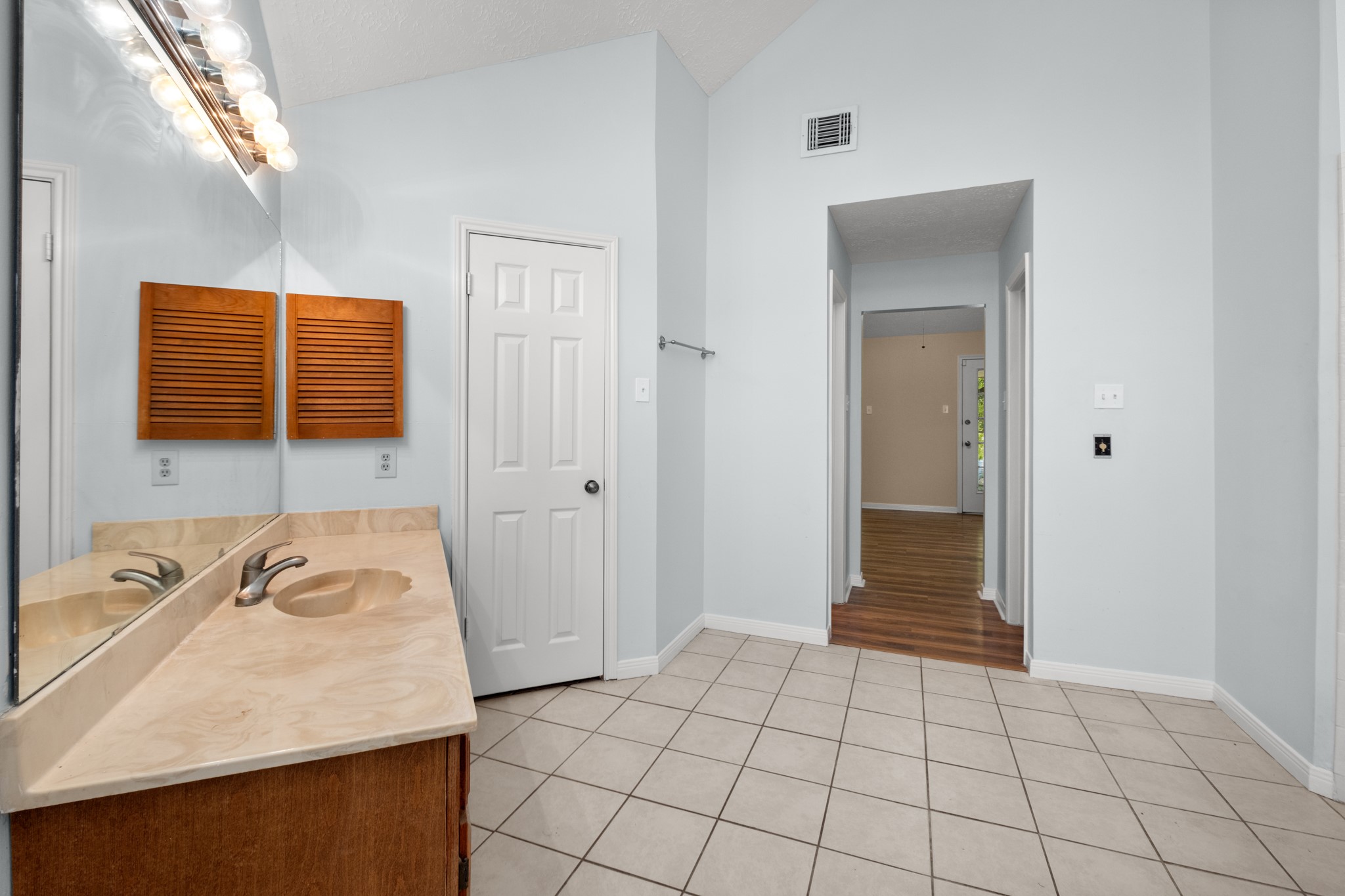 4131 Club Valley Drive Houston, TX 77082 - Photo 24 of 28 a bathroom with a sink a vanity and a mirror