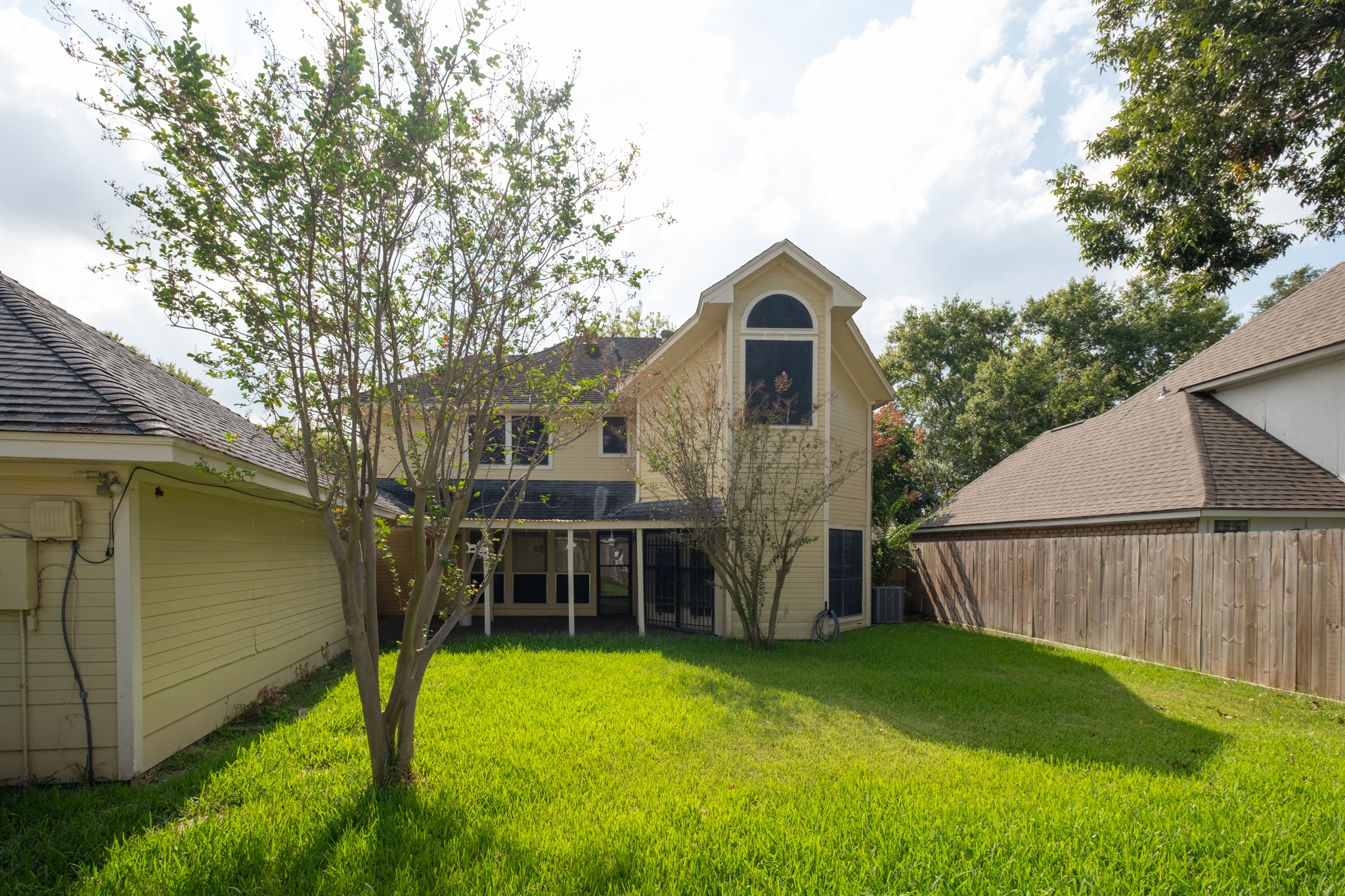 4131 Club Valley Drive Houston, TX 77082 - Photo 28 of 28 a view of backyard with barbeque grill and a large tree