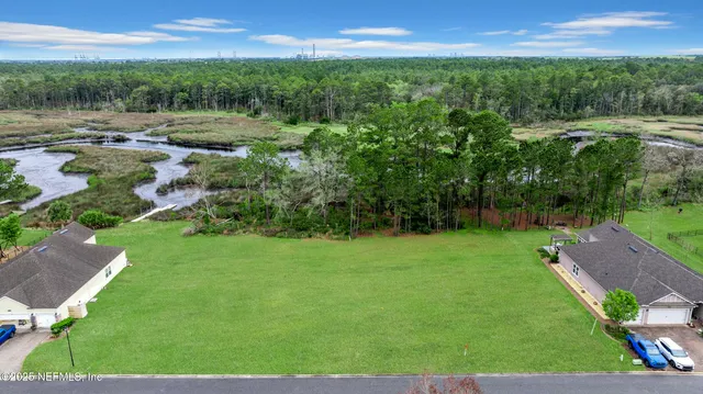 a view of a lake with a yard