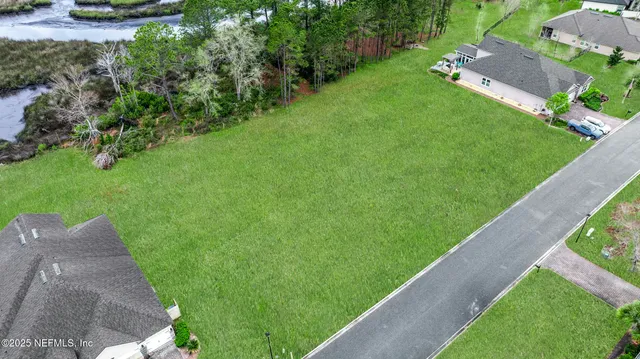 a view of a backyard with potted plants