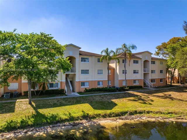 a view of swimming pool with outdoor seating