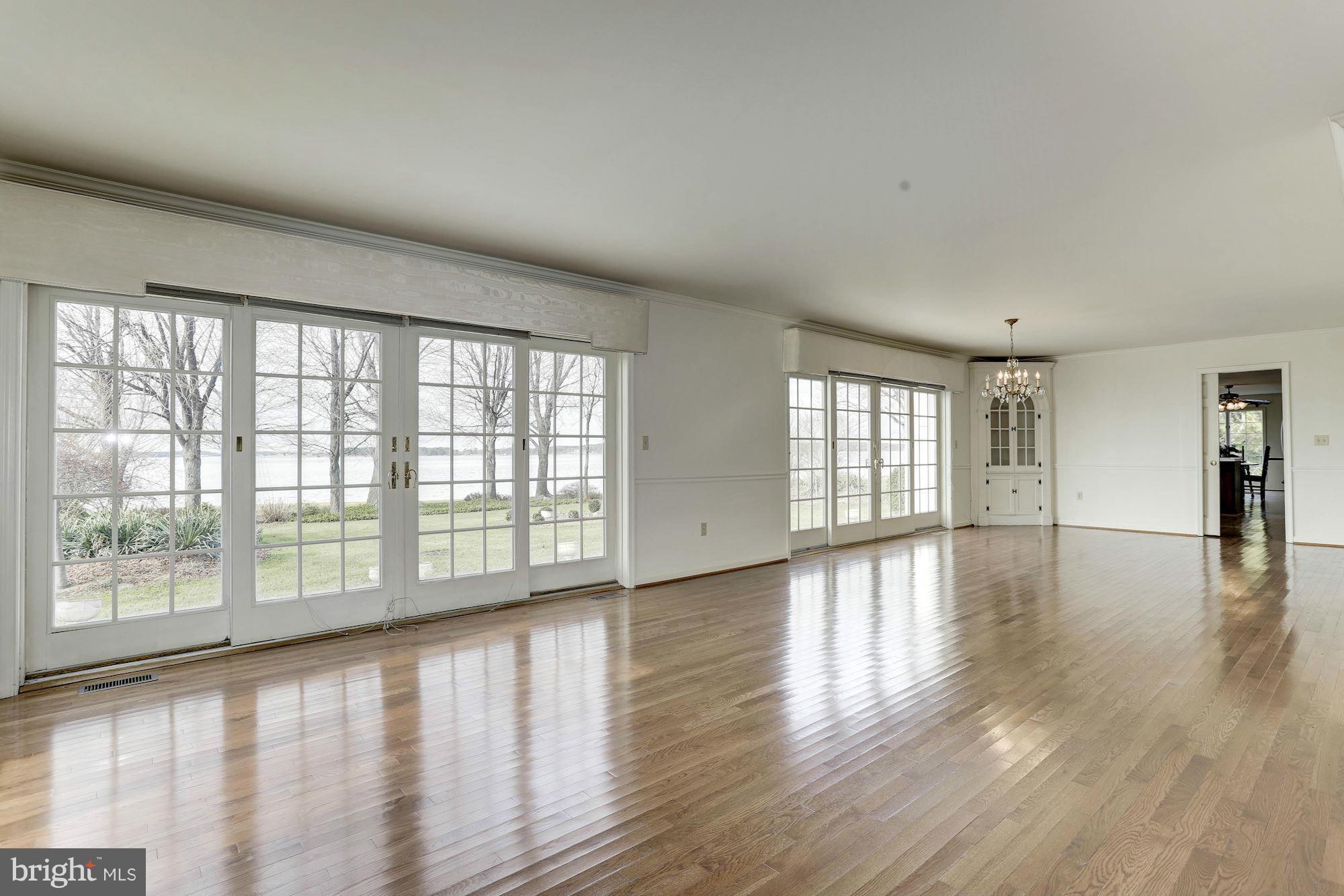2848 Cox Neck Road Chester, MD 21619 - Photo 14 of 30 Living Room flows into the waterfront dining room