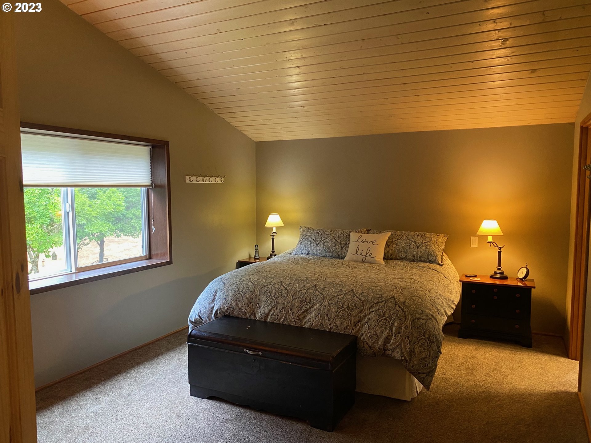 18156 Highway 36 Blachly, OR 97412 - Photo 24 of 48 a bedroom with a bed and window