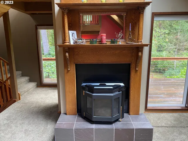 a living room with a fireplace and a window