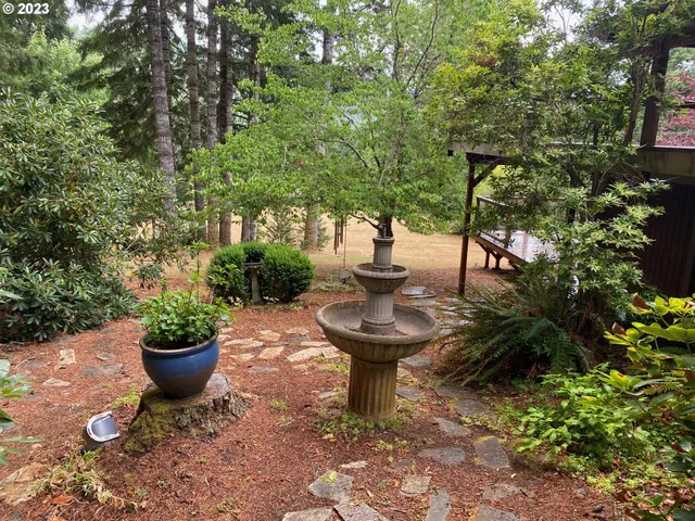 a view of a backyard with sitting area