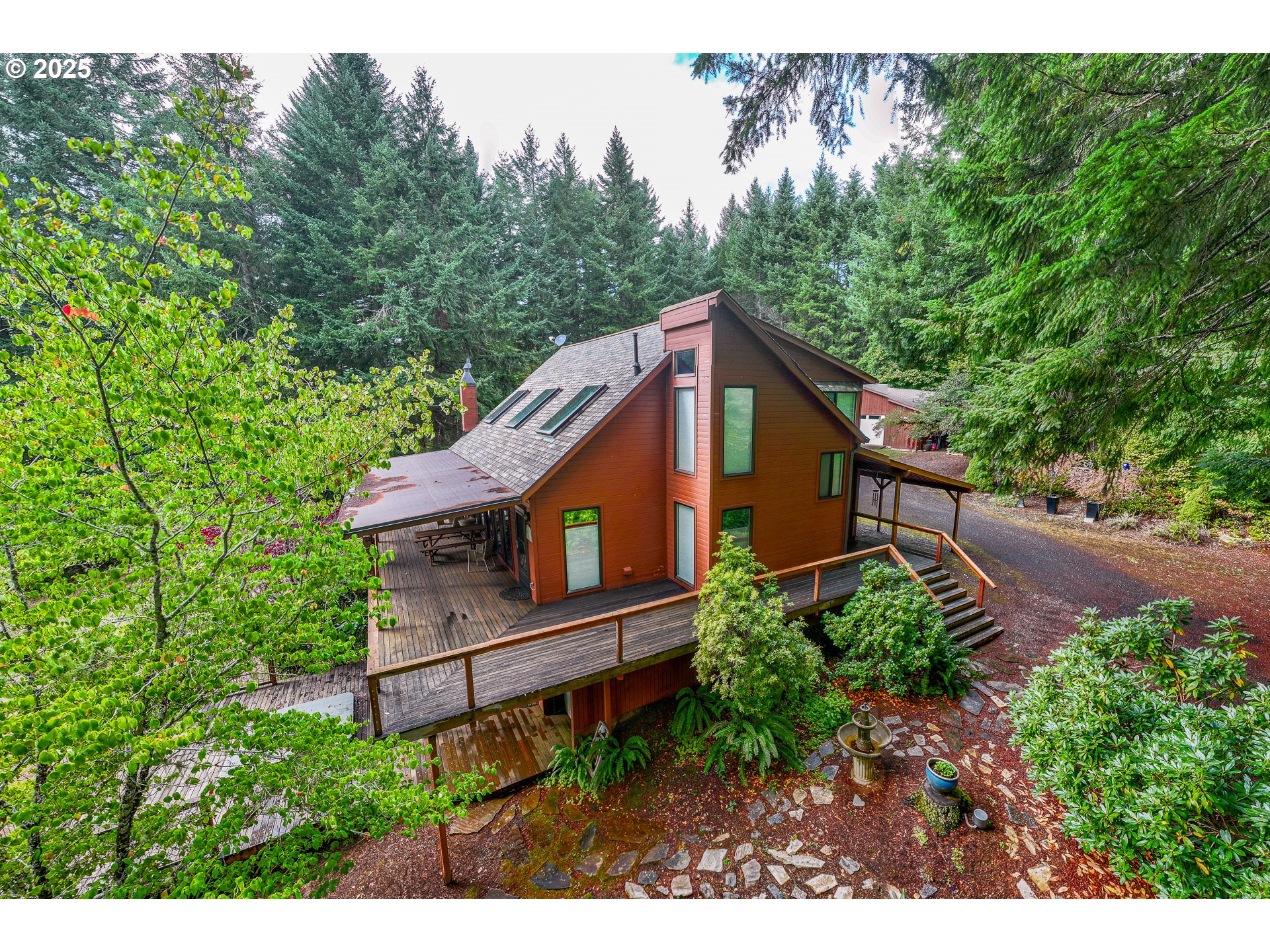 18156 Highway 36 Blachly, OR 97412 - Photo 4 of 48 a aerial view of a house with a yard and potted plants