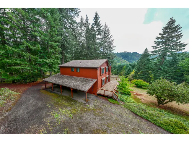 a backyard of a house with a yard and outdoor seating