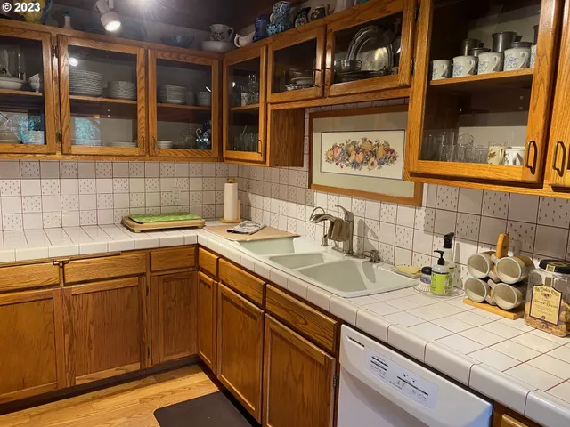 a kitchen with a sink and cabinets