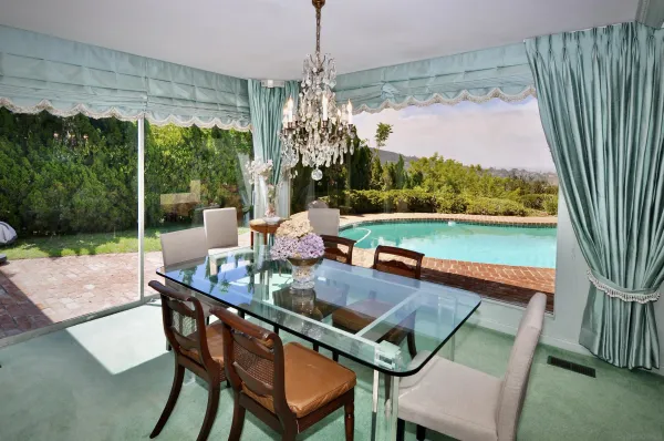 a view of a dining room with furniture window and outside view
