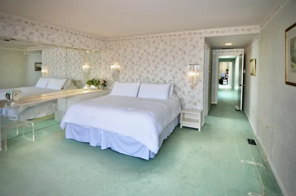 a bedroom with a bed and closet