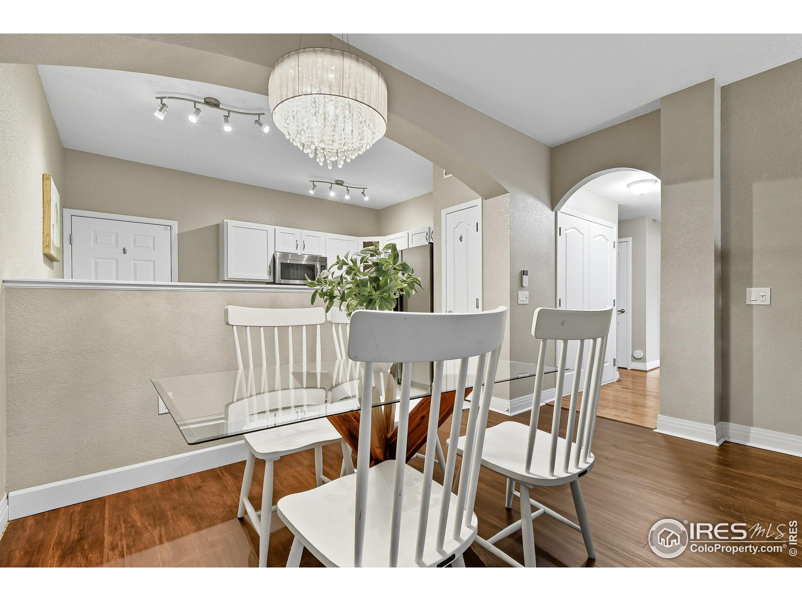 159 Quebec Street, Unit D Denver, CO 80220 - Photo 15 of 49 a view of dining room and wooden floor