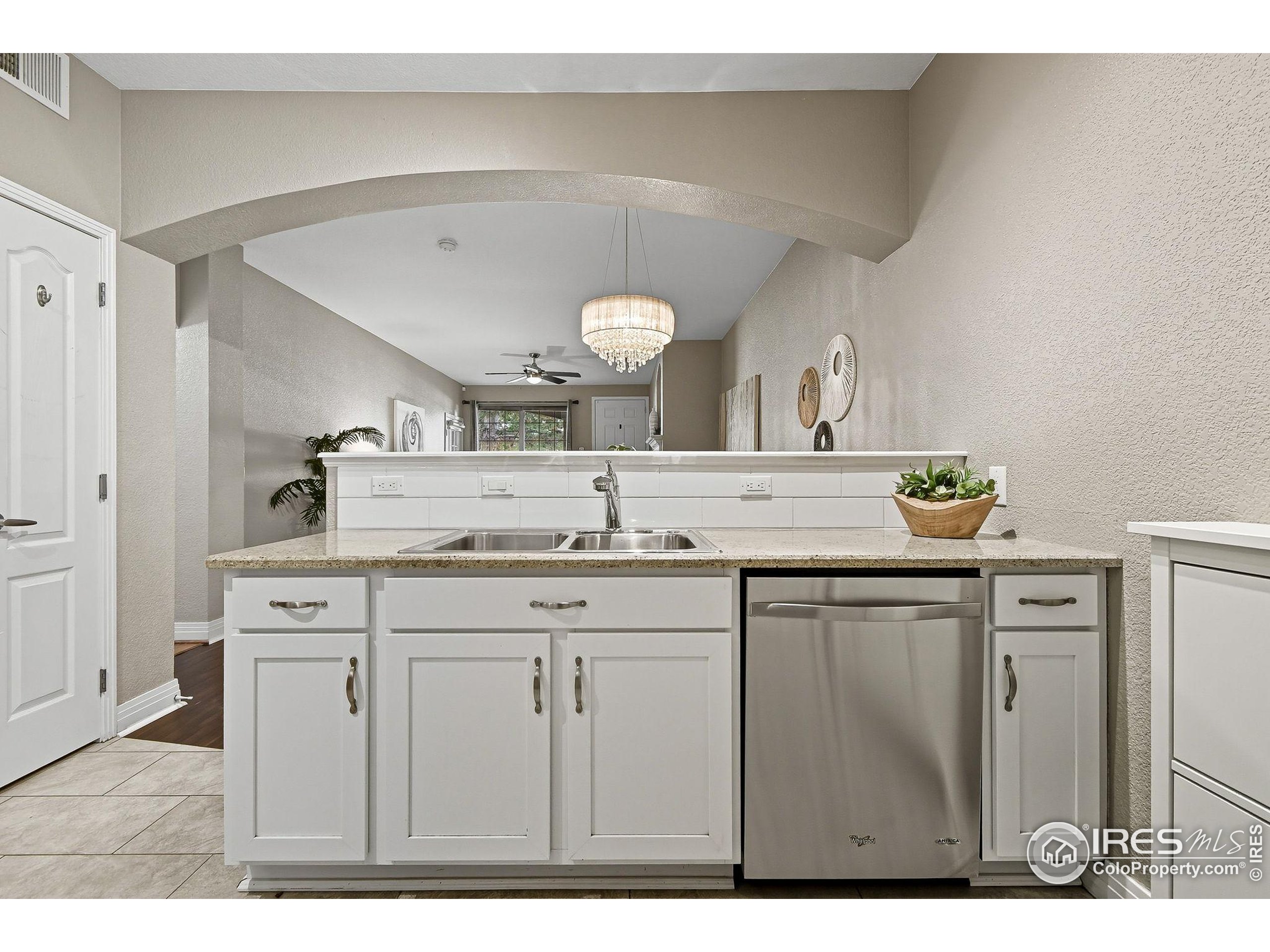 159 Quebec Street, Unit D Denver, CO 80220 - Photo 23 of 49 a bathroom with a sink and a mirror