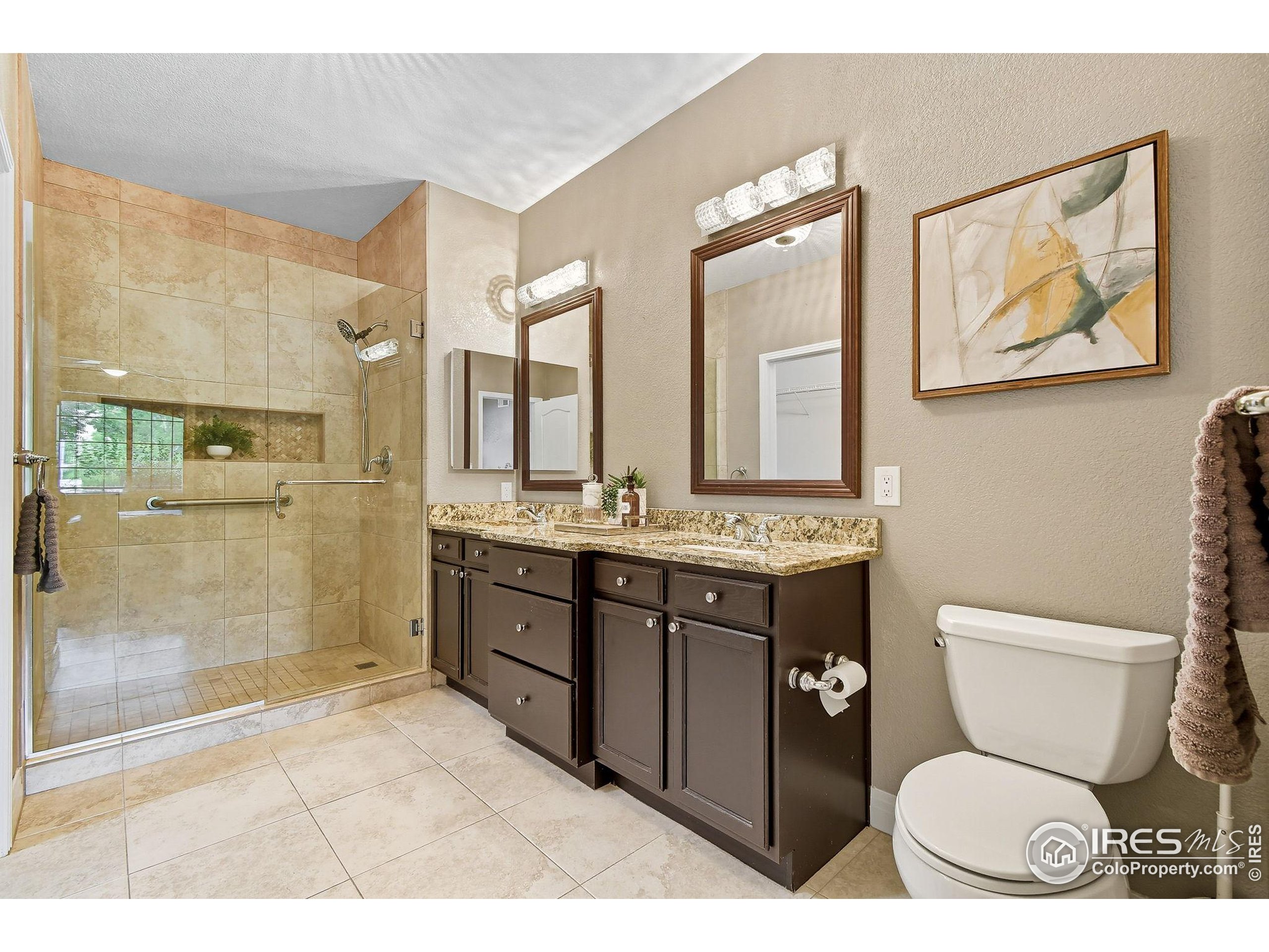 159 Quebec Street, Unit D Denver, CO 80220 - Photo 35 of 49 a bathroom with a toilet a sink and mirror