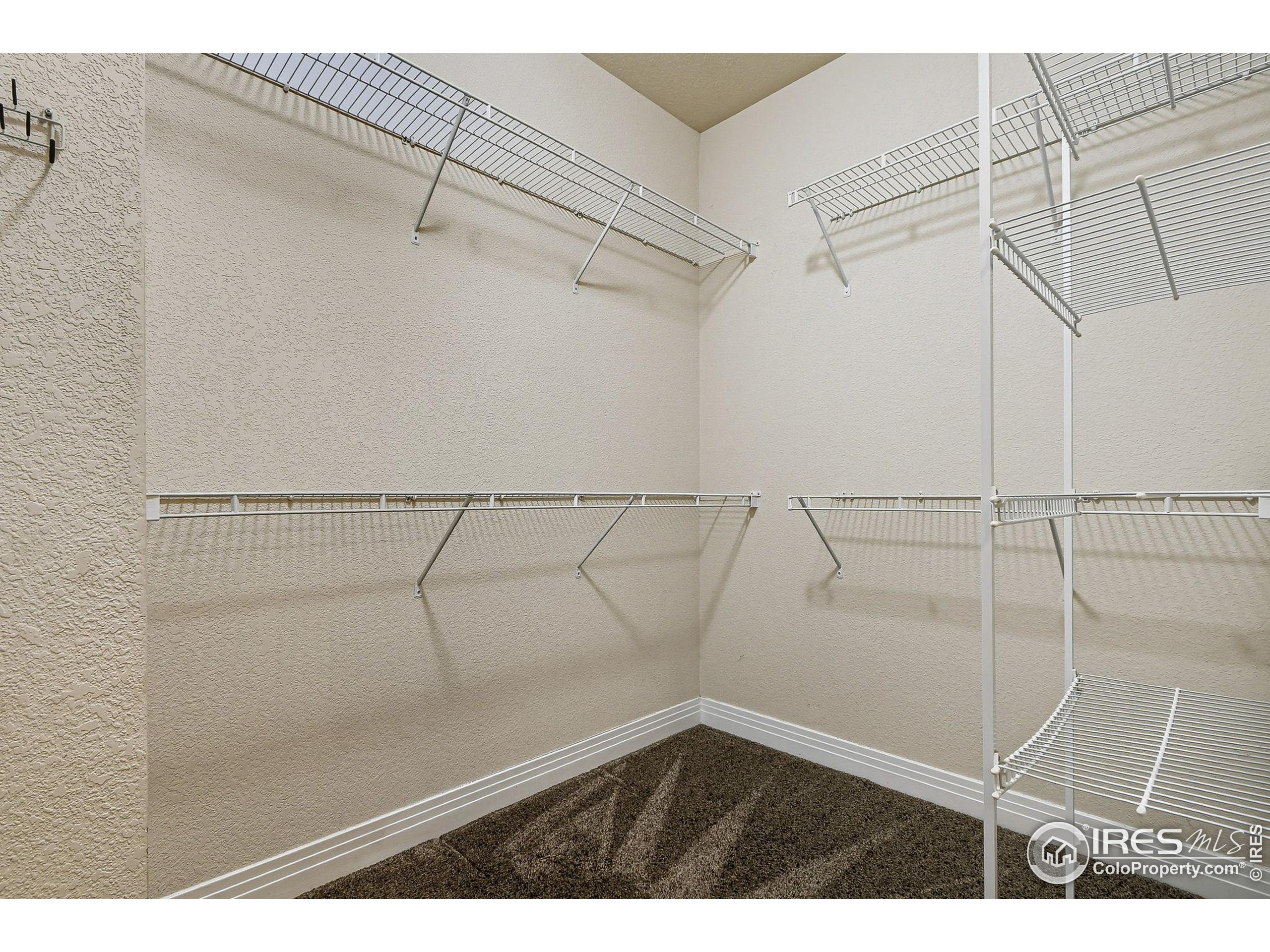 159 Quebec Street, Unit D Denver, CO 80220 - Photo 40 of 49 a view of a room with racks on the wall