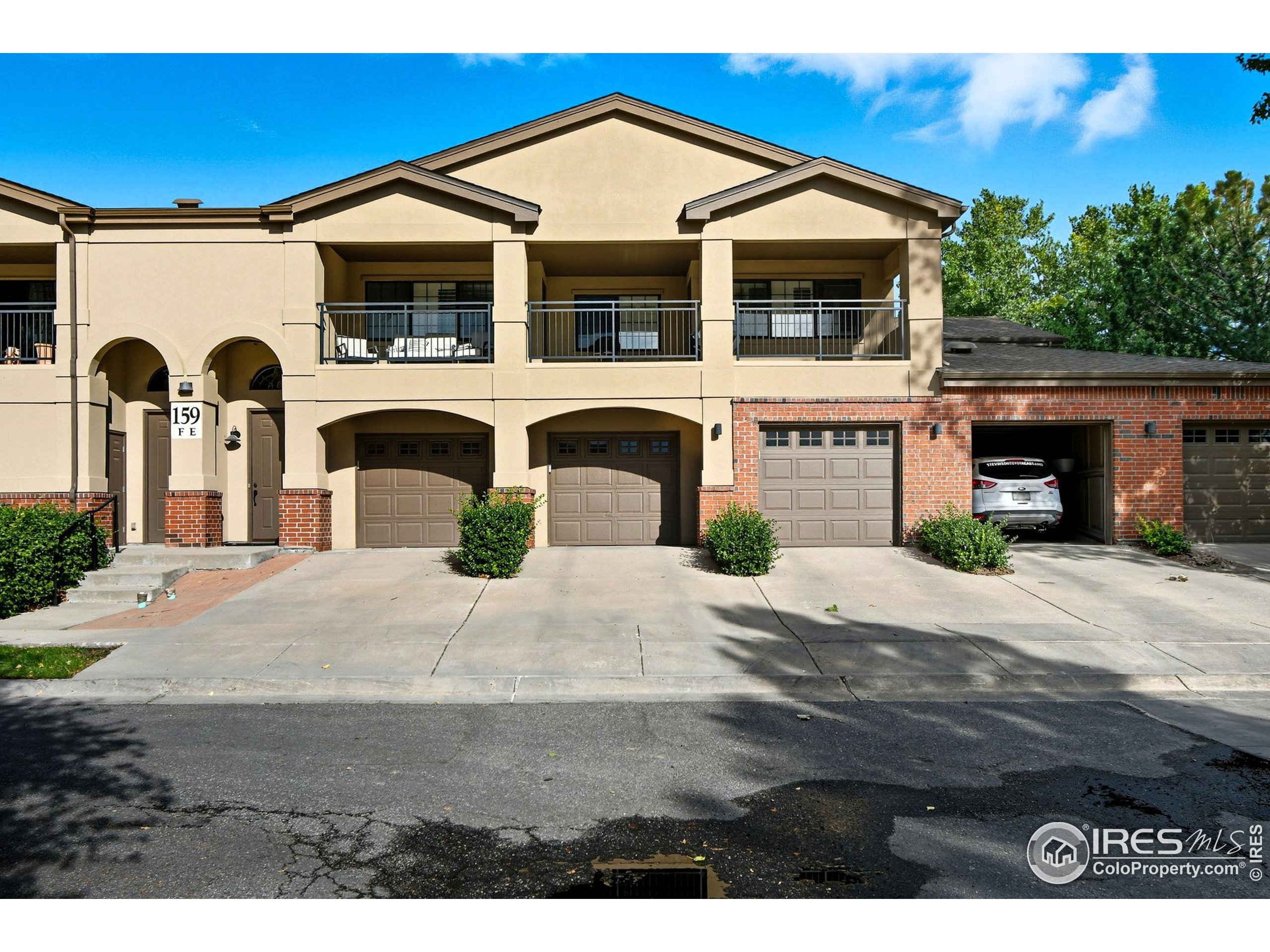 159 Quebec Street, Unit D Denver, CO 80220 - Photo 46 of 49 a front view of a house with a yard