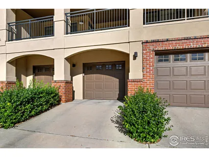 a front view of a house with garage