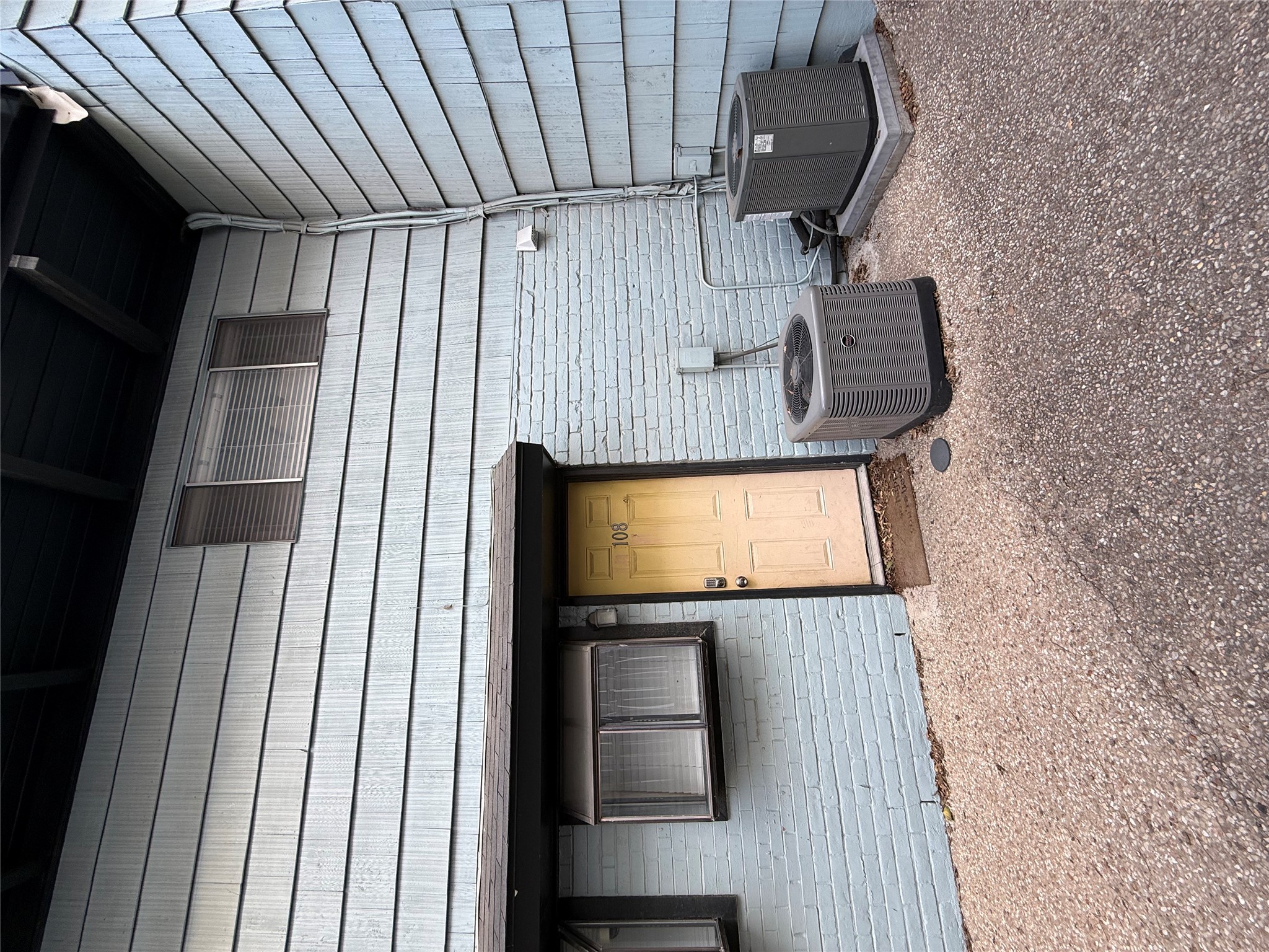 2413 Leon Street, Unit 108 Austin, TX 78705 - Photo 18 of 22 Property entrance featuring brick siding