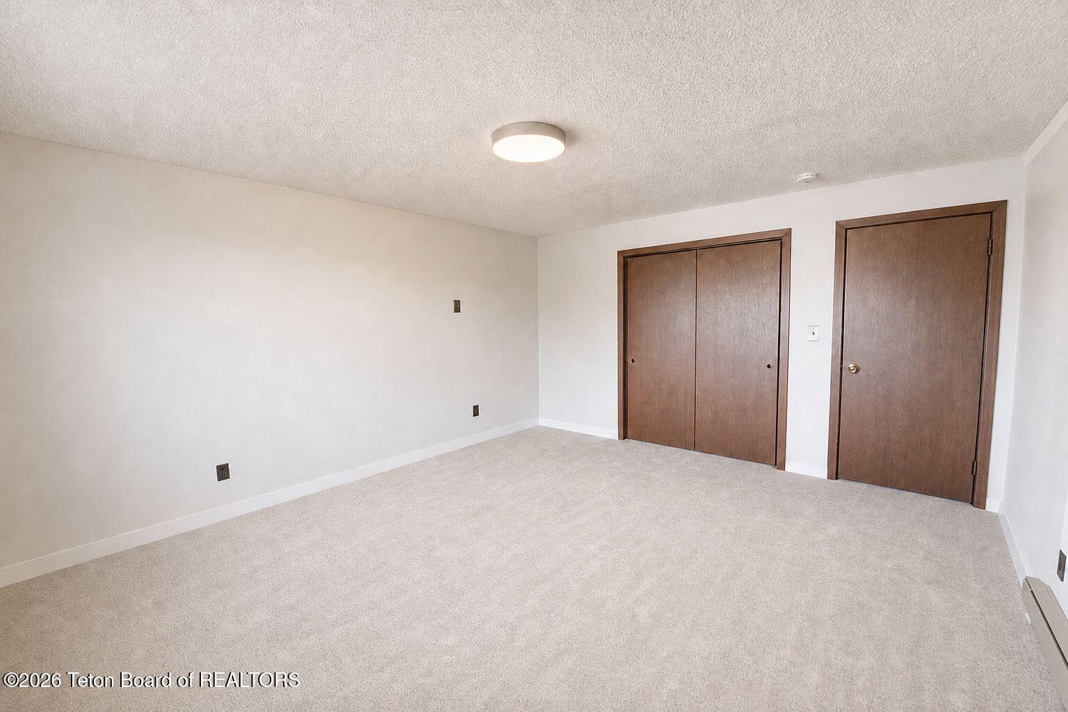 20 Elk Run Road Pinedale, WY 82941 - Photo 23 of 37 Lower Level Bedroom 1